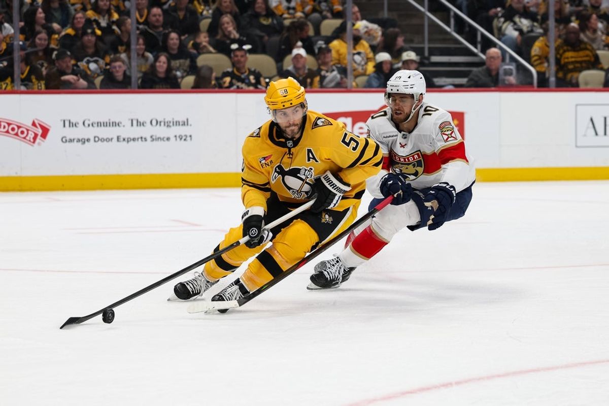 Apr 5, 2026; Pittsburgh, Pennsylvania, USA; Pittsburgh Penguins defenseman Kris Letang (58) controls the puck against the Florida Panthers during the second period at PPG Paints Arena. Mandatory Credit: Mark Alberti-Imagn Images