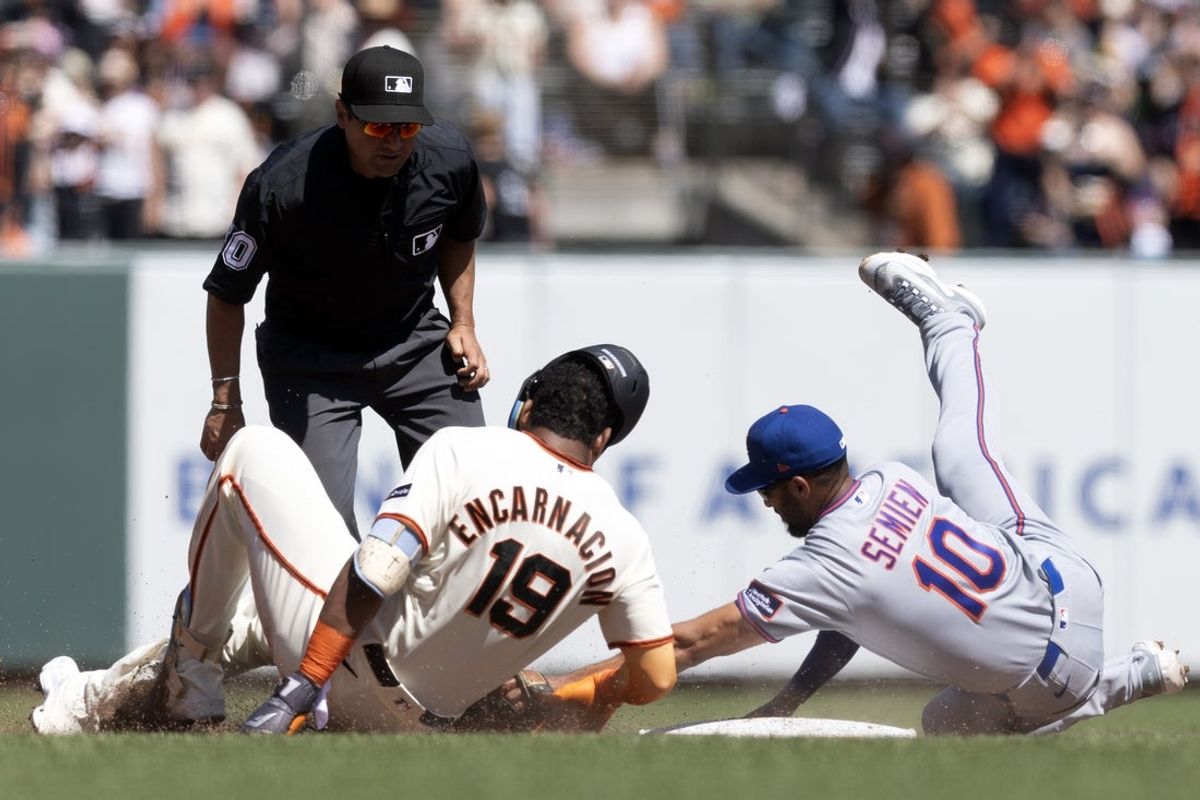 Apr 5, 2026; San Francisco, California, USA; New York Mets second baseman Marcus Semien (10) tags out San Francisco Giants designated hitter Jerar Encarnacion (19), who was trying to stretch his single into two bases during the fifth inning at Oracle Park. Umpire is Charlie Ramos (50). Mandatory Credit: D. Ross Cameron-Imagn Images