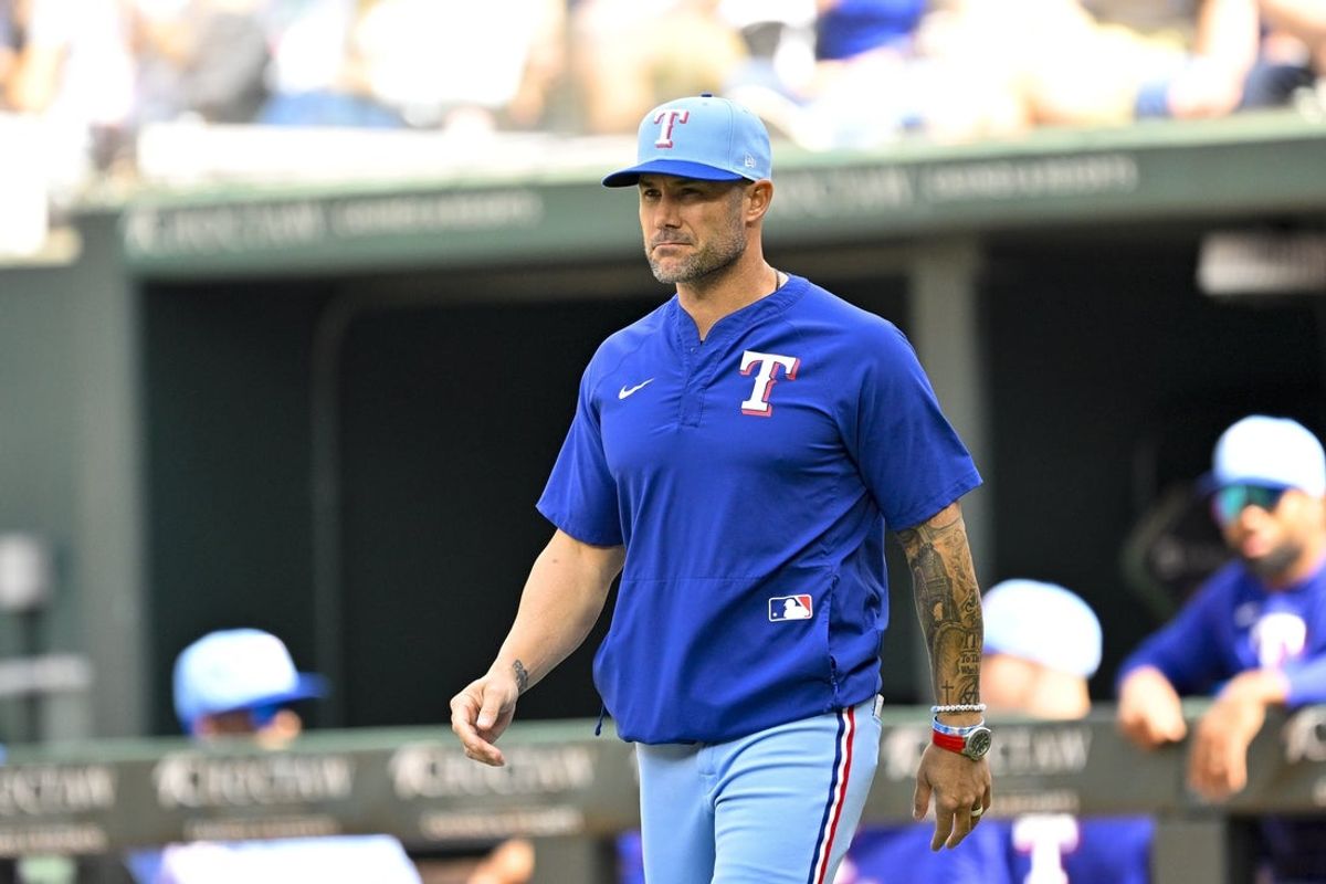 Apr 5, 2026; Arlington, Texas, USA; Texas Rangers manager Skip Schumaker (55) walks to the mound during the eighth inning against the Cincinnati Reds at Globe Life Field. Mandatory Credit: Jerome Miron-Imagn Images