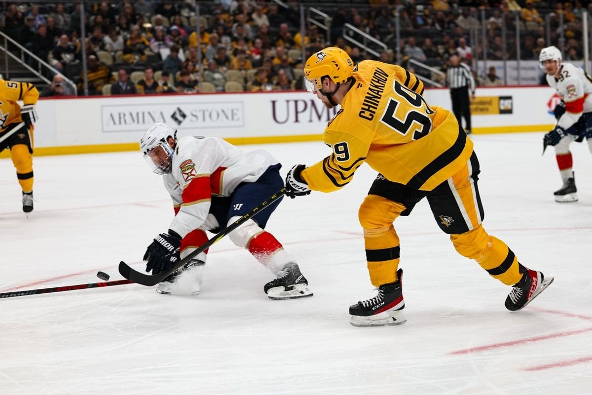 Apr 5, 2026; Pittsburgh, Pennsylvania, USA; Pittsburgh Penguins right wing Egor Chinakhov (59) shoot the puck against the Florida Panthers during the third period at PPG Paints Arena. Mandatory Credit: Mark Alberti-Imagn Images