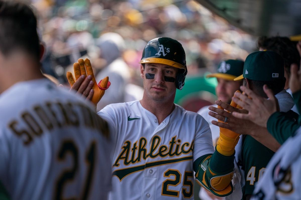 Apr 5, 2026; West Sacramento, California, USA; Athletics right fielder Brent Rooker (25) celebrates with teammates in the dugout with an RBI sacrifice fly ball against the Houston Astros during the fifth inning at Sutter Health Park. Mandatory Credit: Neville E. Guard-Imagn Images
