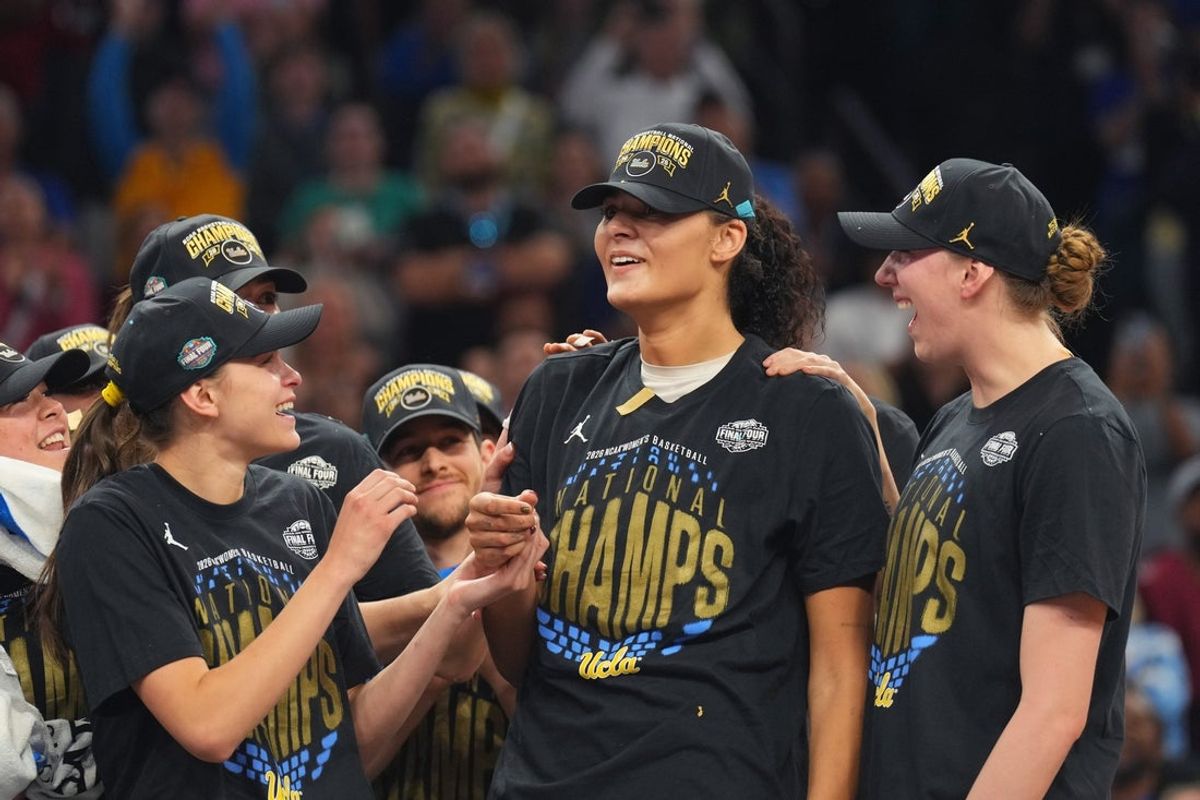 Apr 5, 2026; Phoenix, AZ, USA; UCLA Bruins center Lauren Betts (51) celebrates on the podium after defeating the South Carolina Gamecocks during the National Championship game of the women's 2026 NCAA Tournament at Mortgage Matchup Center. Mandatory Credit: Joe Camporeale-Imagn Images