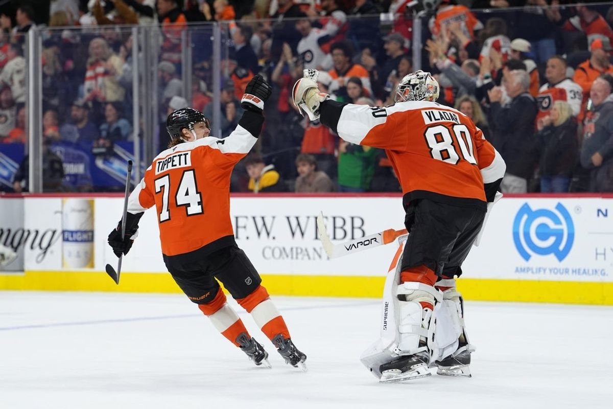 Apr 5, 2026; Philadelphia, Pennsylvania, USA; Philadelphia Flyers right wing Owen Tippett (74) celebrates with goalie Dan Vladar (80) after the game against the Boston Bruins at Xfinity Mobile Arena. Mandatory Credit: Kyle Ross-Imagn Images