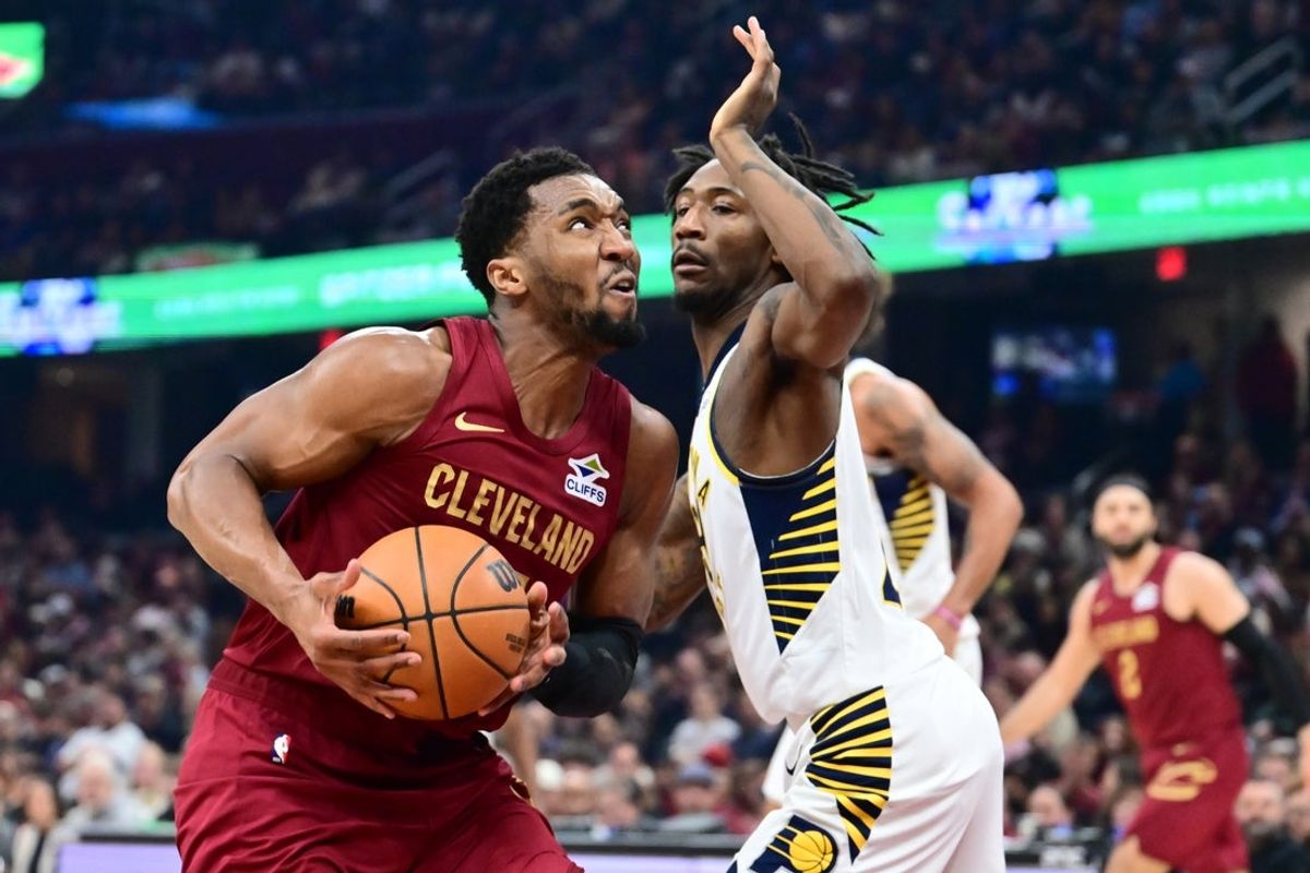 Apr 5, 2026; Cleveland, Ohio, USA; Cleveland Cavaliers guard Donovan Mitchell (45) drives to the basket against Indiana Pacers guard Quenton Jackson (29) during the first half at Rocket Arena. Mandatory Credit: Ken Blaze-Imagn Images