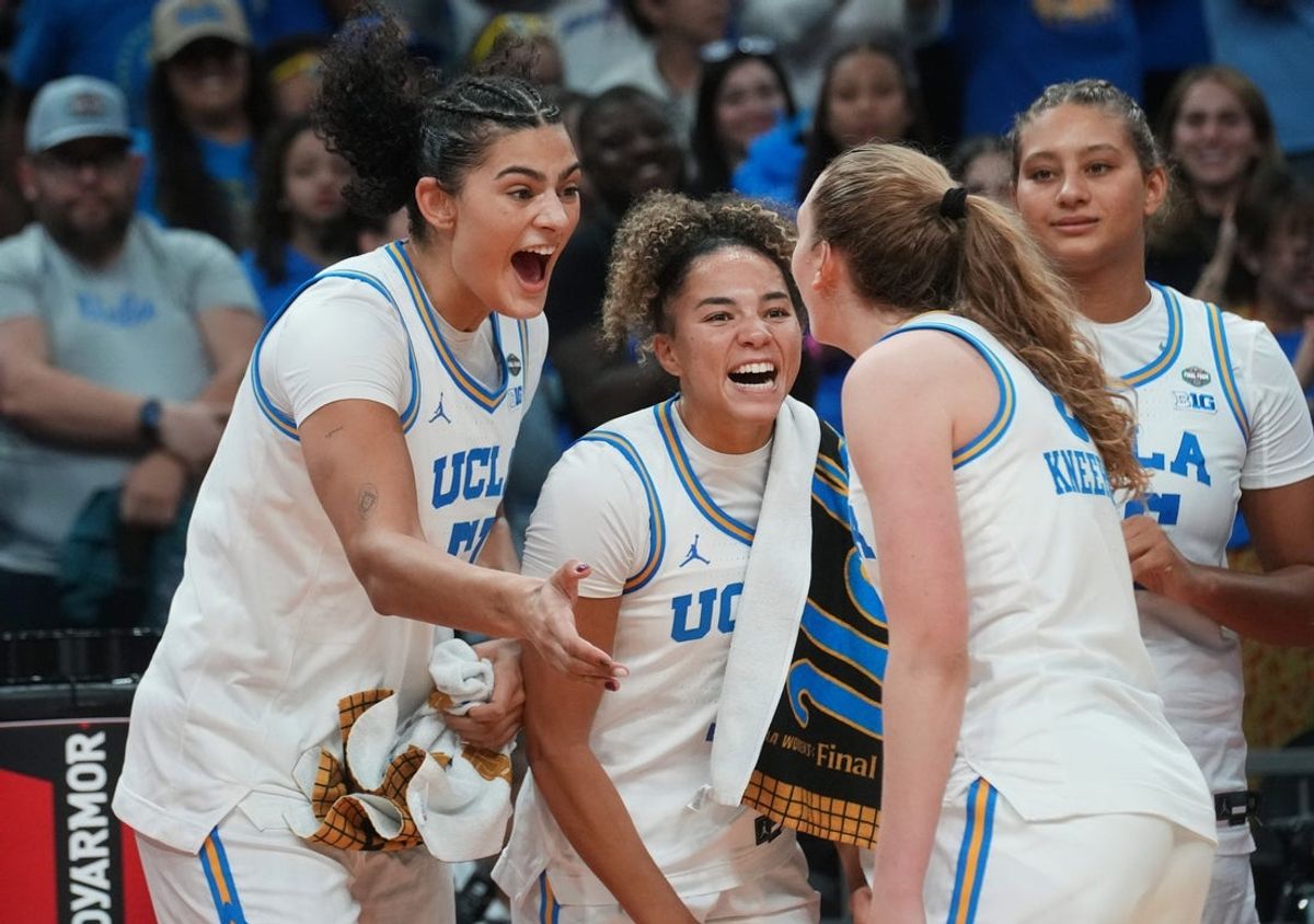 UCLA Bruins players Lauren Betts, from left, and Kiki Rice celebrate with teammates their 79-51 win over the South Carolina Gamecocks to claim the NCAA women's basketball national championship at Mortgage Matchup Center in Phoenix on April 5, 2026.