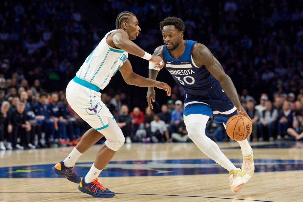 Apr 5, 2026; Minneapolis, Minnesota, USA; Minnesota Timberwolves forward Julius Randle (30) drives on Charlotte Hornets forward Moussa Diabate (14) in the first quarter at Target Center. Mandatory Credit: Matt Blewett-Imagn Images