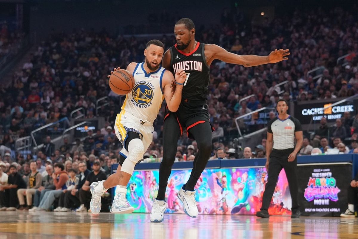 Apr 5, 2026; San Francisco, California, USA; Golden State Warriors guard Stephen Curry (30) dribbles the ball next to Houston Rockets forward Kevin Durant (7) in the first quarter at the Chase Center. Mandatory Credit: Cary Edmondson-Imagn Images