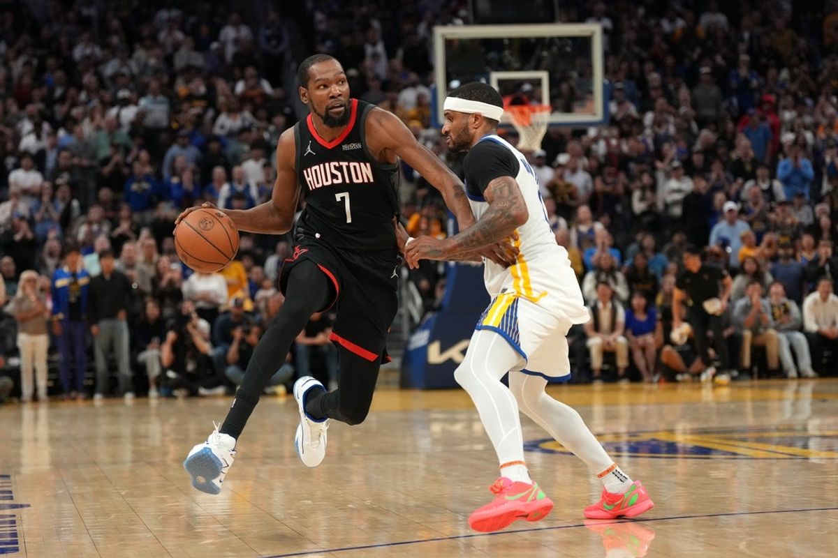 Apr 5, 2026; San Francisco, California, USA; Houston Rockets forward Kevin Durant (7) dribbles the ball next to Golden State Warriors guard Gary Payton II (0) in the fourth quarter at the Chase Center. Mandatory Credit: Cary Edmondson-Imagn Images
