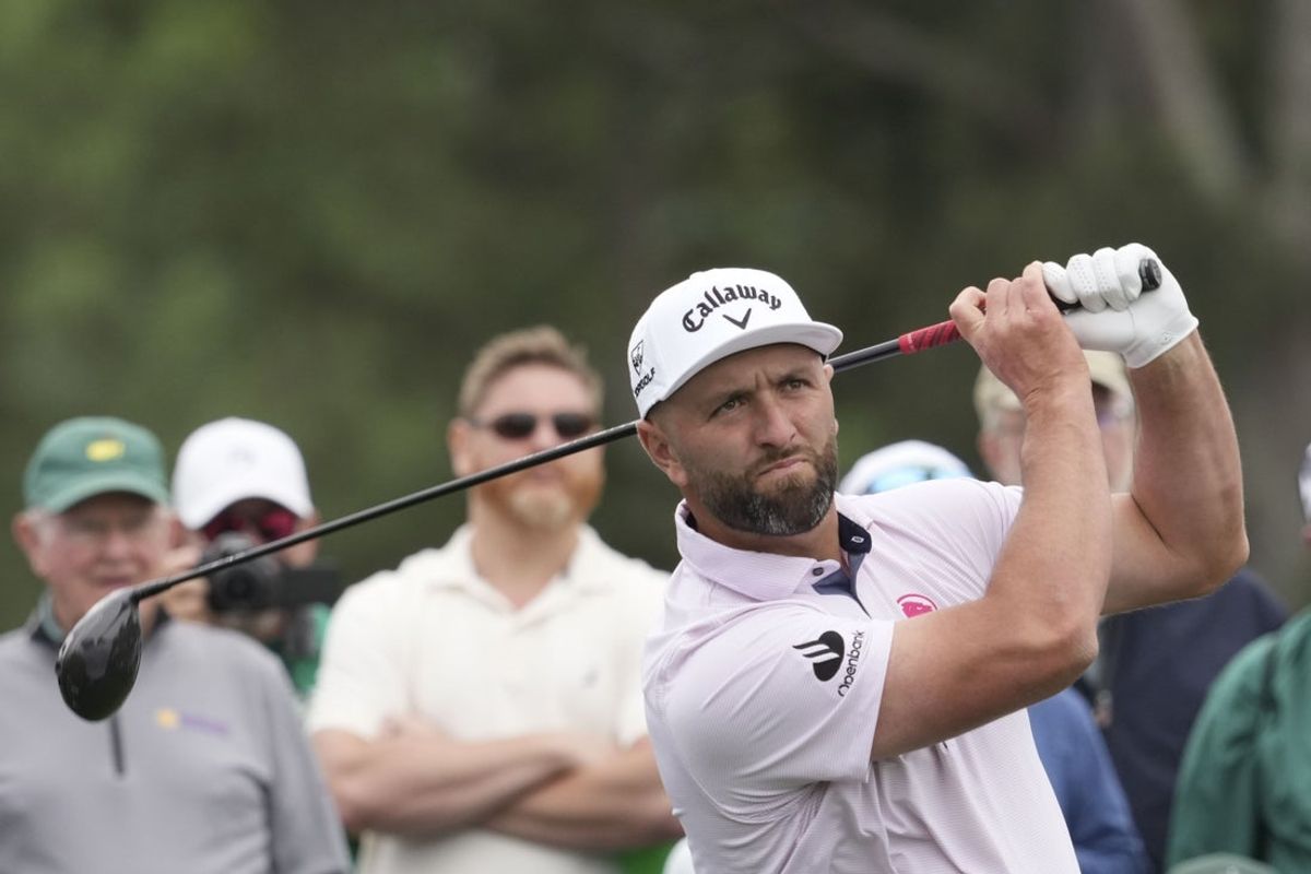 Apr 6, 2026; Augusta, Georgia, USA; Jon Rahm hits his tee shot on the eighth hole during a practice round for the Masters Tournament at Augusta National Golf Club. Mandatory Credit: Michael Madrid-Imagn Images