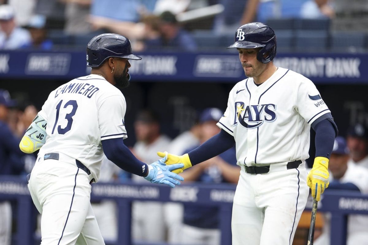 Apr 6, 2026; St. Petersburg, Florida, USA; Tampa Bay Rays center fielder Chandler Simpson (14) greets catcher Nick Fortes (40) after hitting a home run against the Chicago Cubs in the third inning at Tropicana Field. Mandatory Credit: Nathan Ray Seebeck-Imagn Images