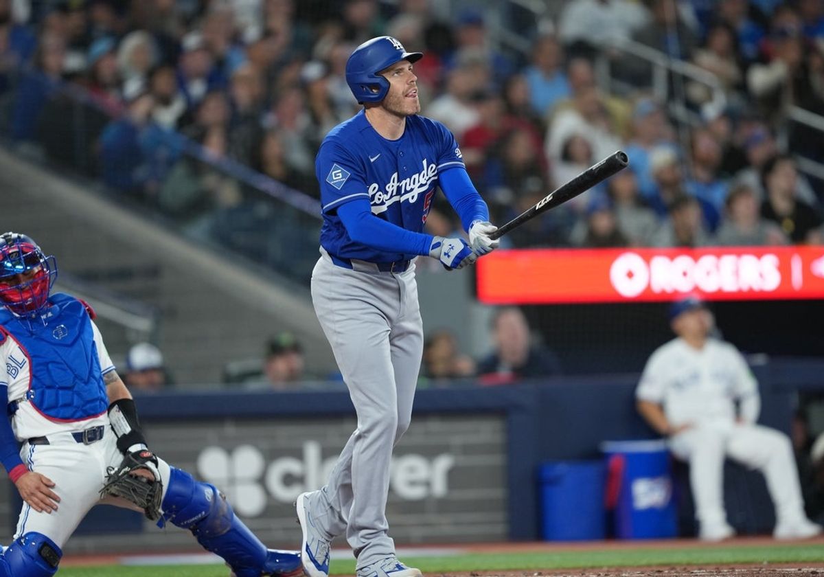Apr 6, 2026; Toronto, Ontario, CAN; Los Angeles Dodgers first baseman Freddie Freeman (5) hits a two-run home run against the Toronto Blue Jays during the third inning at Rogers Centre. Mandatory Credit: Nick Turchiaro-Imagn Images