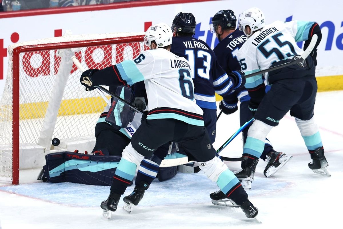 Apr 6, 2026; Winnipeg, Manitoba, CAN; Winnipeg Jets center Jonathan Toews (19) scores on Seattle Kraken goaltender Philipp Grubauer (31) in the first period at Canada Life Centre. Mandatory Credit: James Carey Lauder-Imagn Images