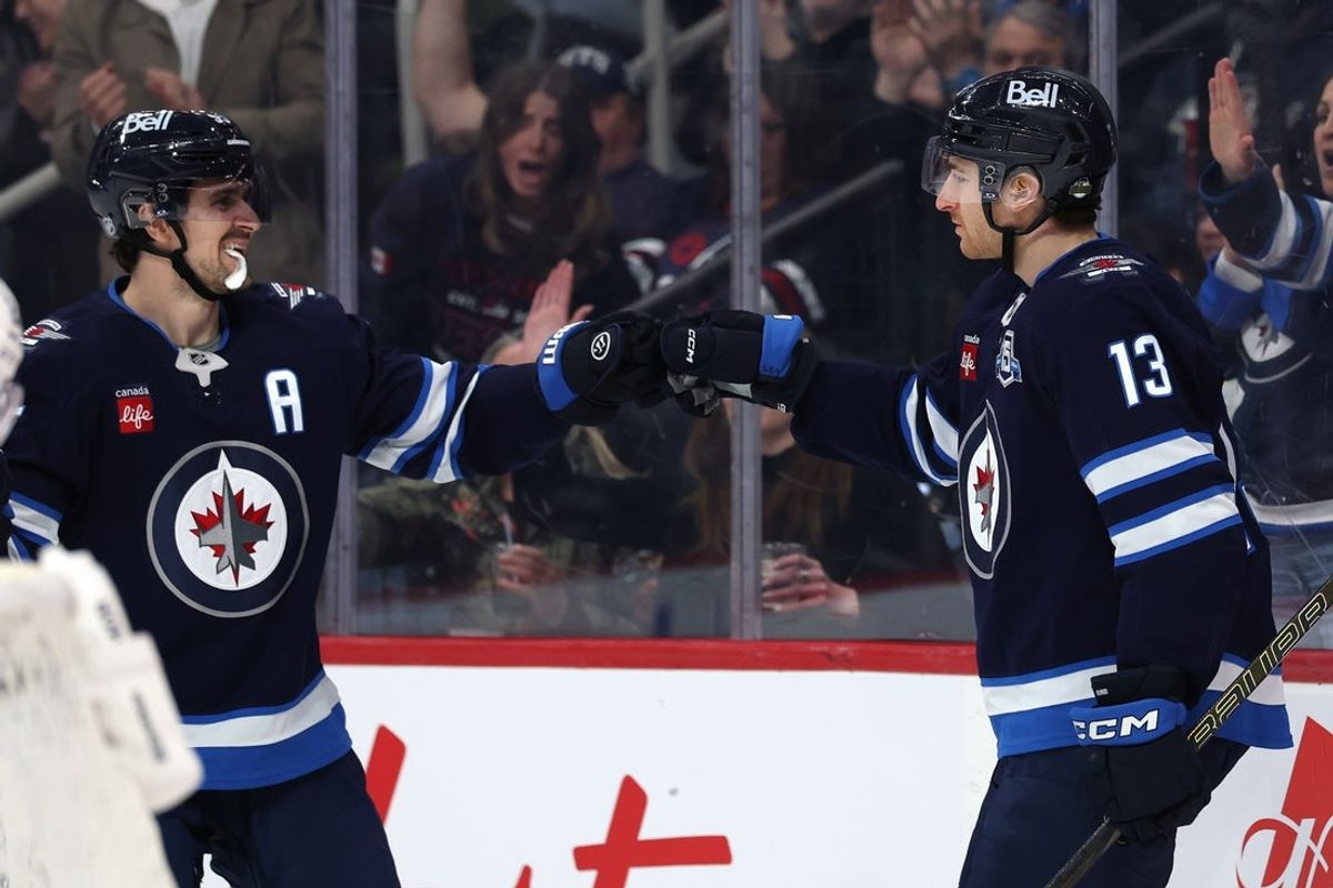 Apr 6, 2026; Winnipeg, Manitoba, CAN; Winnipeg Jets center Gabriel Vilardi (13) celebrates a goal against the Seattle Kraken with Winnipeg Jets center Mark Scheifele (55) in the second period at Canada Life Centre. Mandatory Credit: James Carey Lauder-Imagn Images