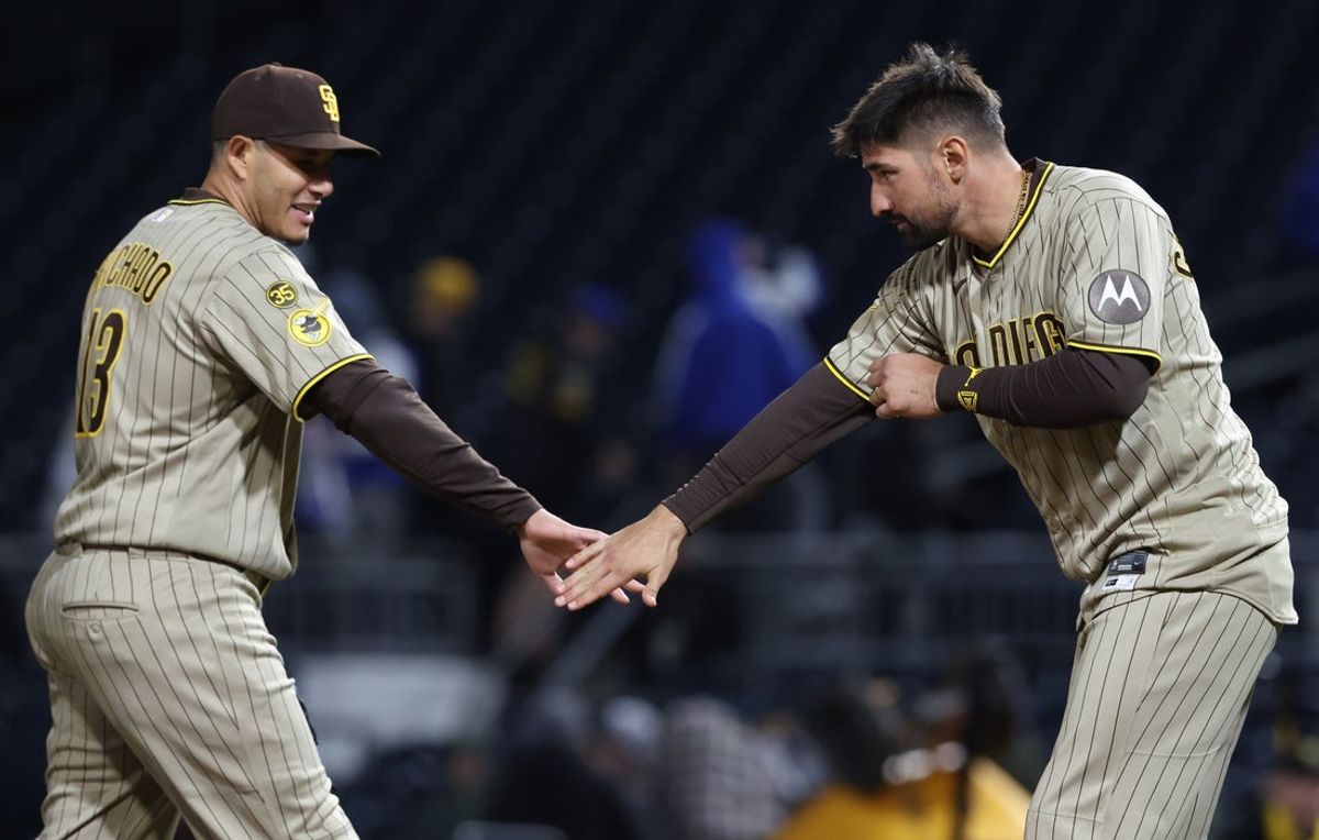 Apr 6, 2026; Pittsburgh, Pennsylvania, USA;  San Diego Padres third baseman Manny Machado (13) and designated hitter Nick Castellanos (right) celebrate after defeating the Pittsburgh Pirates at PNC Park. Mandatory Credit: Charles LeClaire-Imagn Images
