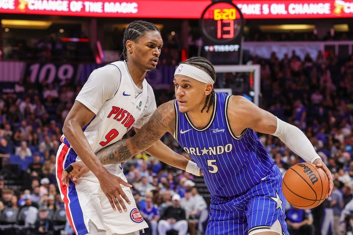 Apr 6, 2026; Orlando, Florida, USA; Orlando Magic forward Paolo Banchero (5) drives past Detroit Pistons guard Ausar Thompson (9) during the second half at Kia Center. Mandatory Credit: Mike Watters-Imagn Images