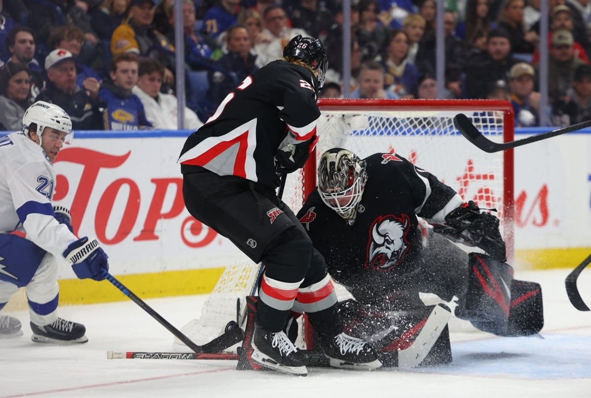 Apr 6, 2026; Buffalo, New York, USA;  Buffalo Sabres goaltender Ukko-Pekka Luukkonen (1) makes a save on Tampa Bay Lightning center Brayden Point (21) during the third period at KeyBank Center. Mandatory Credit: Timothy T. Ludwig-Imagn Images