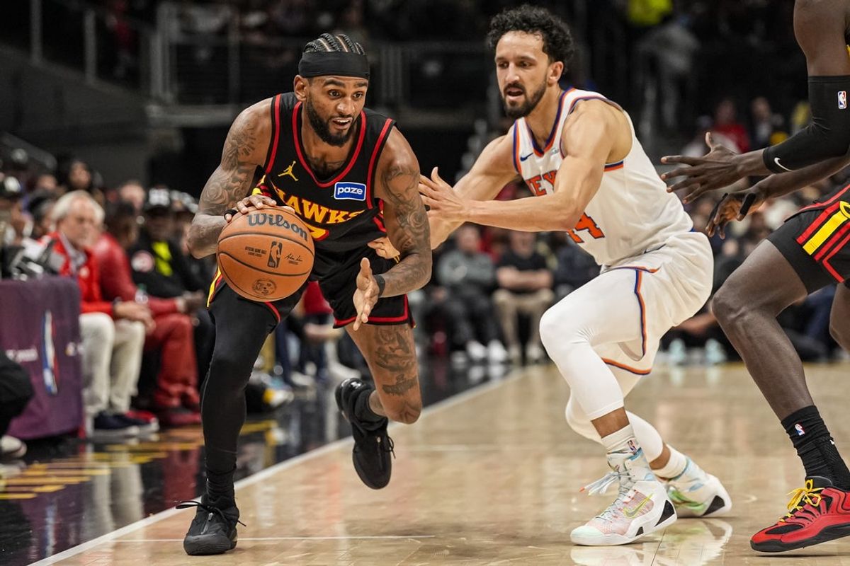 Apr 6, 2026; Atlanta, Georgia, USA; Atlanta Hawks guard Nickeil Alexander-Walker (7) dribbles past New York Knicks guard Landry Shamet (44) during the second half at State Farm Arena. Mandatory Credit: Dale Zanine-Imagn Images