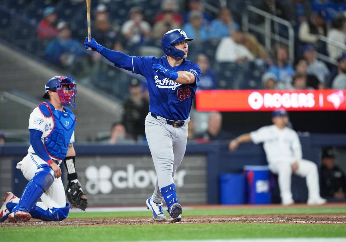 Apr 6, 2026; Toronto, Ontario, CAN; Los Angeles Dodgers catcher Dalton Rushing (68) hits a home run against the Toronto Blue Jays during the eighth inning at Rogers Centre. Mandatory Credit: Nick Turchiaro-Imagn Images