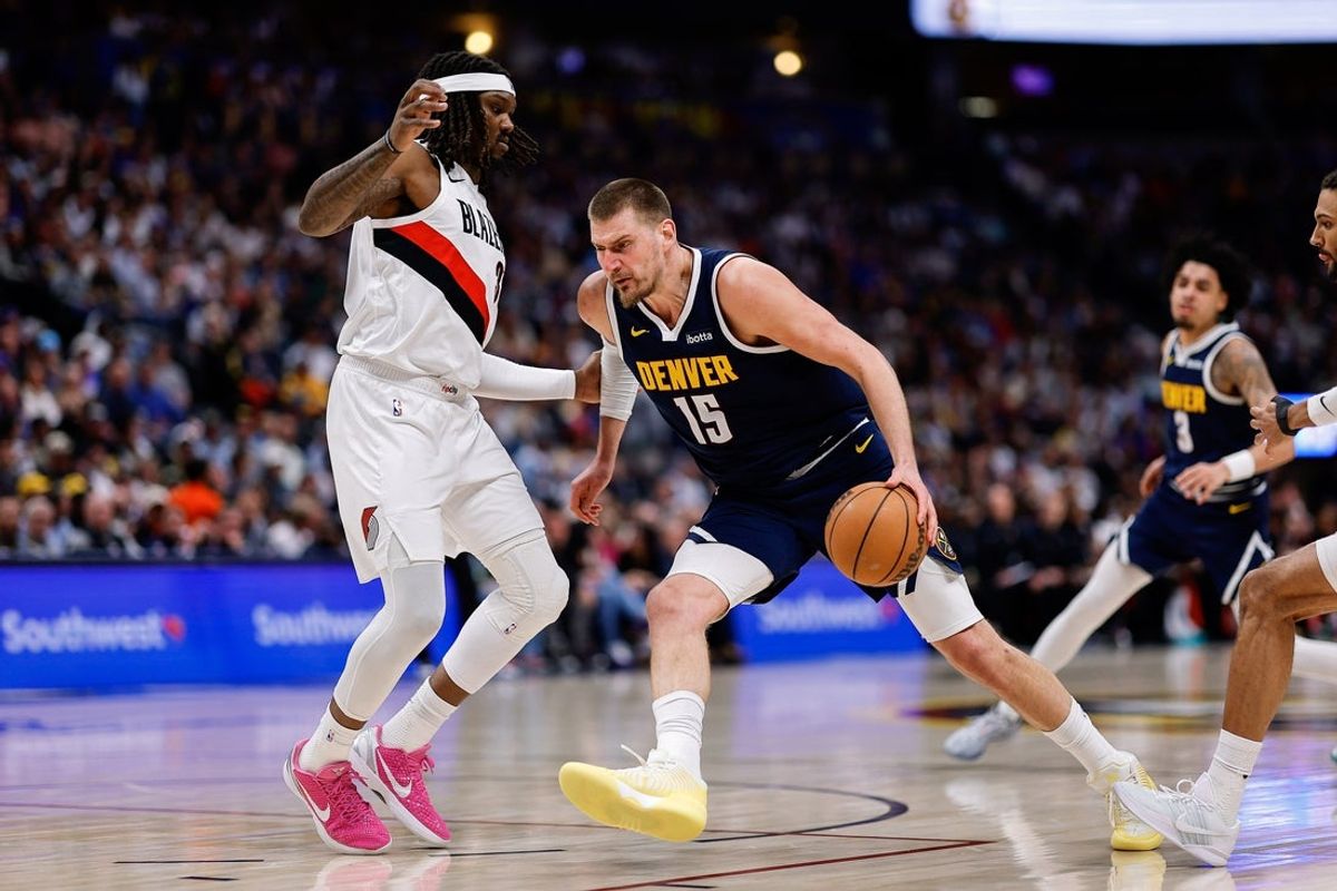 Apr 6, 2026; Denver, Colorado, USA; Denver Nuggets center Nikola Jokic (15) controls the ball as Portland Trail Blazers center Robert Williams III (35) guards in the second quarter at Ball Arena. Mandatory Credit: Isaiah J. Downing-Imagn Images