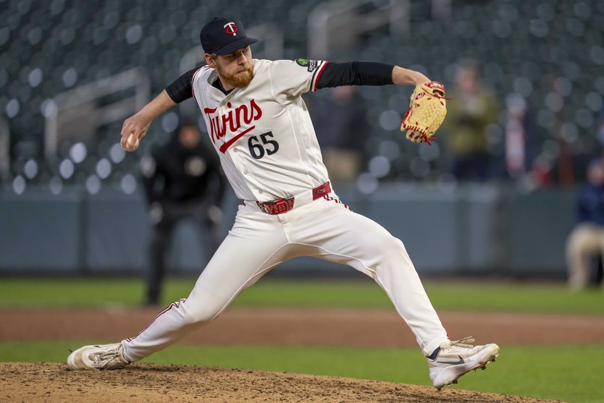 Apr 6, 2026; Minneapolis, Minnesota, USA; Minnesota Twins relief pitcher Cody Laweryson (65) delivers a pitch against the Detroit Tigers in the ninth inning at Target Field. Mandatory Credit: Jesse Johnson-Imagn Images