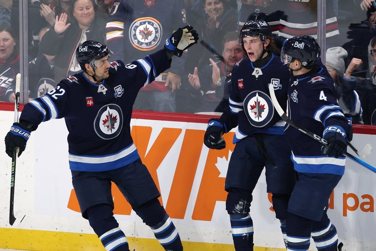 Apr 6, 2026; Winnipeg, Manitoba, CAN; Winnipeg Jets center Brad Lambert (93) celebrates a goal against the Seattle Kraken with Nino Niederreiter (62) and Neal Pionk (4) in the third period at Canada Life Centre. Mandatory Credit: James Carey Lauder-Imagn Images