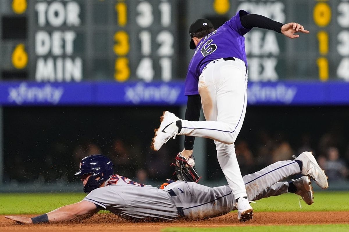 Apr 6, 2026; Denver, Colorado, USA; Houston Astros center fielder Jake Meyers (6) is tagged out stealing second by Colorado Rockies second baseman Edouard Julien (6) in the fifth inning at Coors Field. Mandatory Credit: Ron Chenoy-Imagn Images