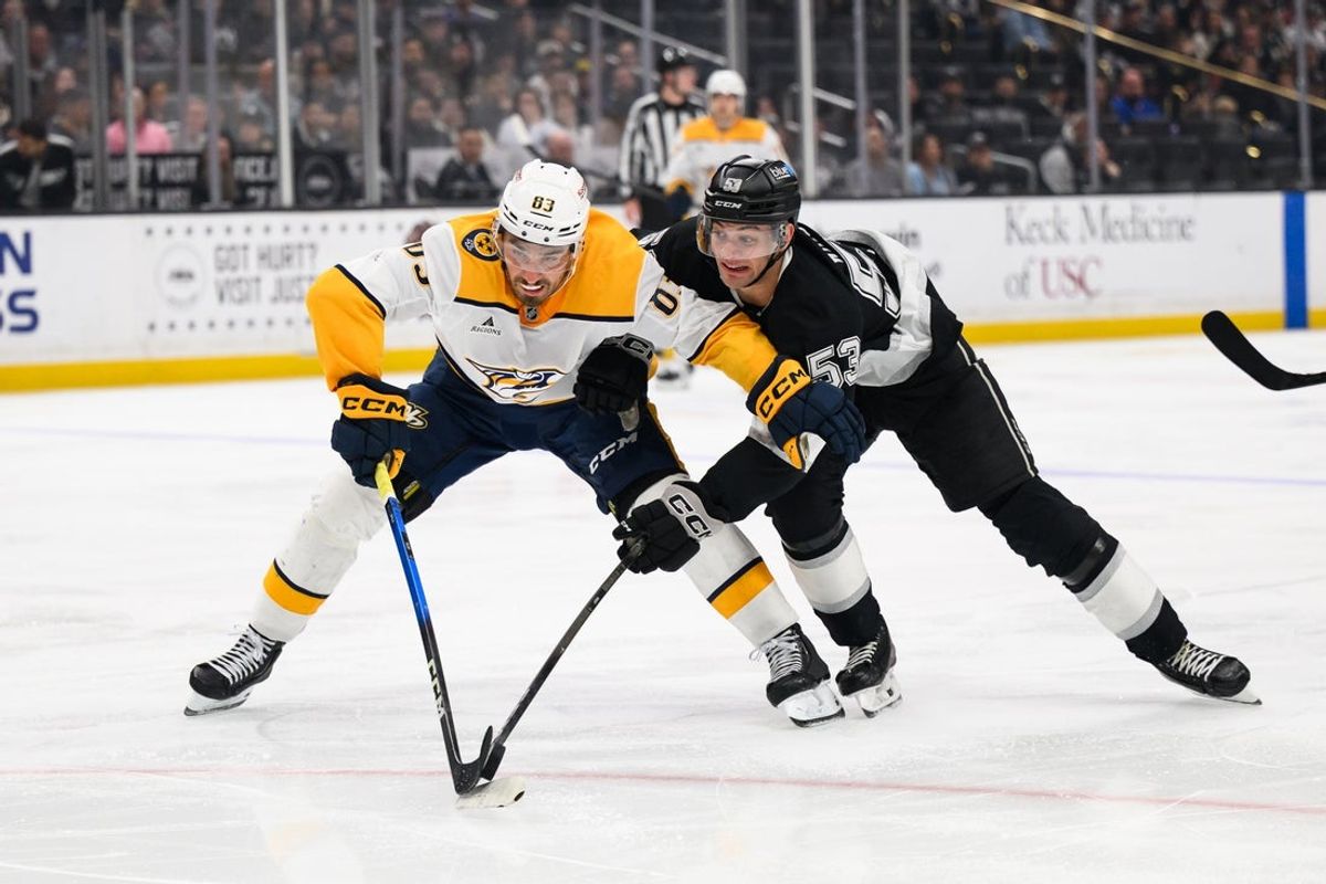 Apr 6, 2026; Los Angeles, California, USA; Nashville Predators defenseman Adam Wilsby (83) and Los Angeles Kings right wing Jared Wright (53) vie for the puck during the second period at Crypto.com Arena. Mandatory Credit: William Liang-Imagn Images