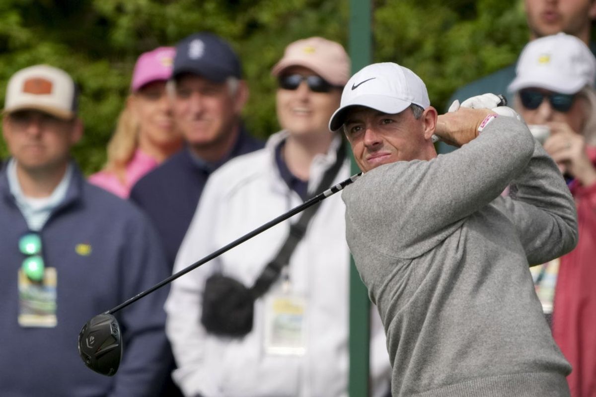 Apr 7, 2026; Augusta, Georgia, USA; Rory McIlroy tees off on no. 14 during a practice round for the Masters Tournament at Augusta National Golf Club. Mandatory Credit: Michael Madrid-Imagn Images