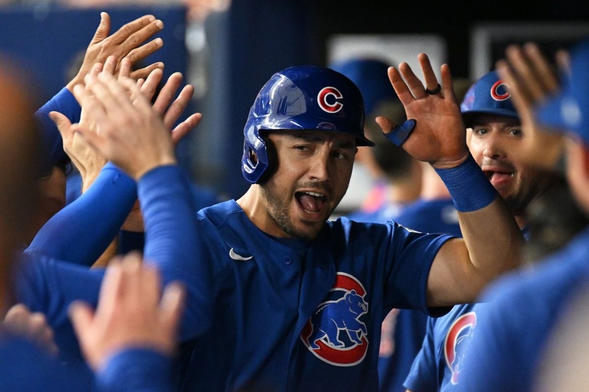 Apr 7, 2026; St. Petersburg, Florida, USA; Chicago Cubs left fielder Michael Conforto (20) celebrates with his teammates after scoring a run  in the second inning against the Tampa Bay Rays at Tropicana Field. Mandatory Credit: Jonathan Dyer-Imagn Images