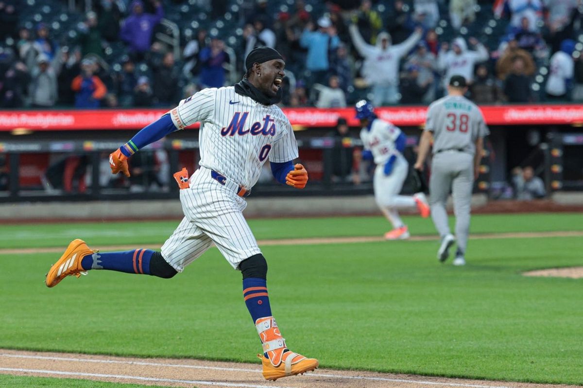 Apr 7, 2026; New York City, New York, USA;  New York Mets pinch hitter Ronny Mauricio (0) celebrates after hitting an RBI walk-off single during the tenth inning against the Arizona Diamondbacks at Citi Field. Mandatory Credit: Vincent Carchietta-Imagn Images