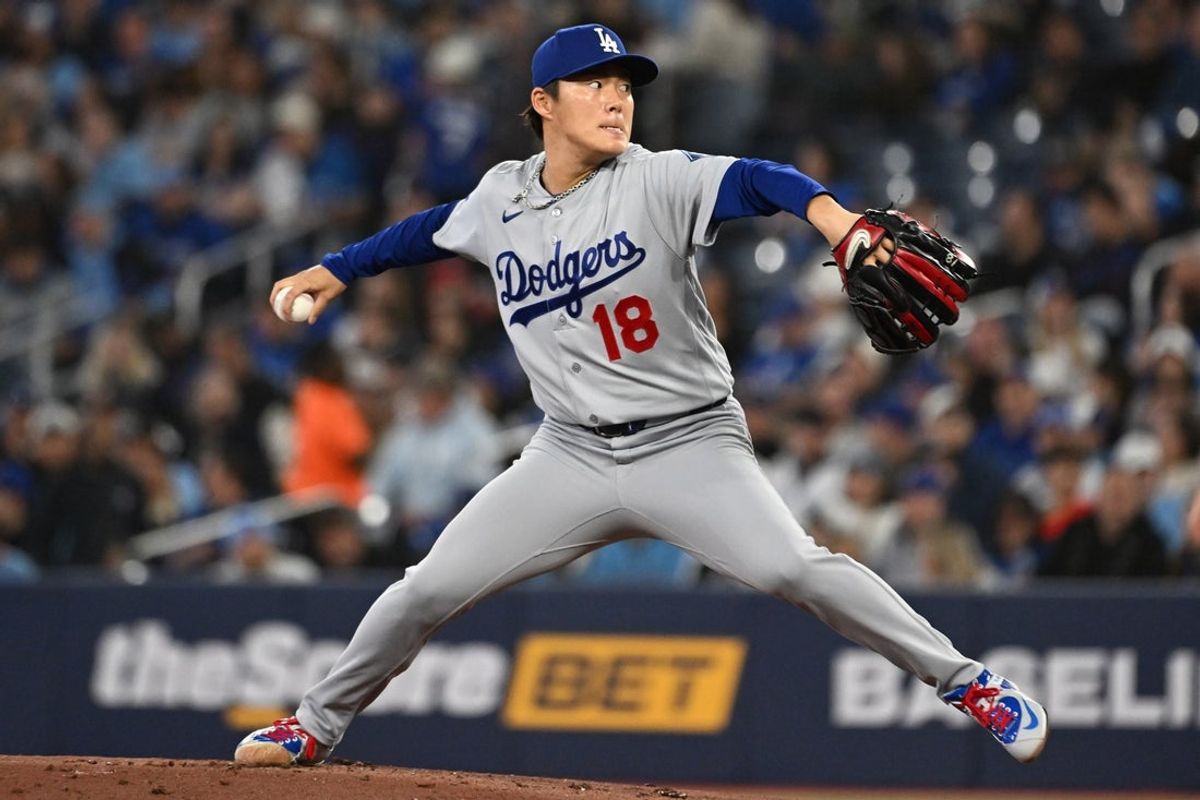 Apr 7, 2026; Toronto, Ontario, CAN;  Los Angeles Dodgers starting pitcher Yoshinobu Yamamoto (18) delivers a pitch against the Toronto Blue Jays in the first inning at Rogers Centre. Mandatory Credit: Dan Hamilton-Imagn Images