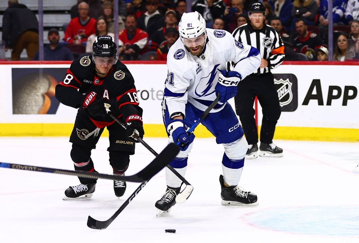 Apr 7, 2026; Ottawa, Ontario, CAN;  Ottawa Senators center Tim Stutzle (18) and Tampa Bay Lightning defenseman Erik Cernak (81) vie for the puck during the first period at Canadian Tire Centre. Mandatory Credit: Keito Newman-Imagn Images