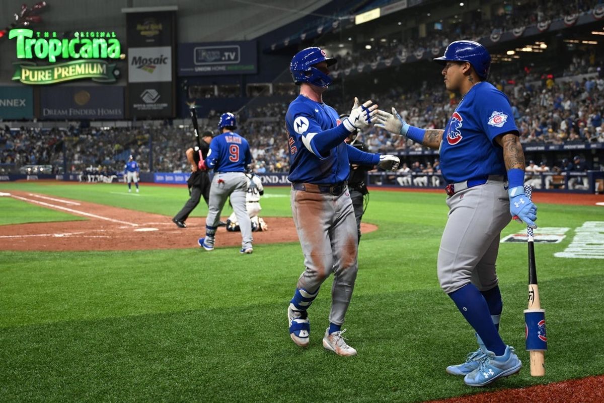 Apr 7, 2026; St. Petersburg, Florida, USA; Chicago Cubs centerfielder Pete Crow-Armstrong (4) celebrates with designated hitter Moises Ballesteros (25) after hitting a solo home run in the seventh inning against the Tampa Bay Rays at Tropicana Field. Mandatory Credit: Jonathan Dyer-Imagn Images