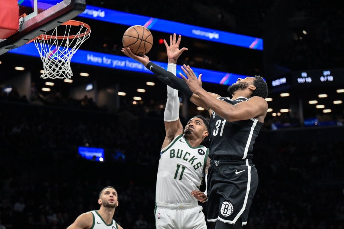 Apr 7, 2026; Brooklyn, New York, USA; Brooklyn Nets guard/forward Chaney Johnson (31) shoots the ball while defended by Milwaukee Bucks guard Gary Harris (11) during the first half at Barclays Center. Mandatory Credit: John Jones-Imagn Images