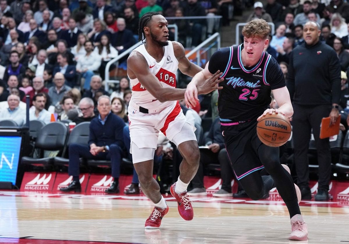 Apr 7, 2026; Toronto, Ontario, CAN; Miami Heat guard Kasparas Jakucionis (25) controls the ball as Toronto Raptors guard Immanuel Quickley (5) defends during the first quarter at Scotiabank Arena. Mandatory Credit: Nick Turchiaro-Imagn Images