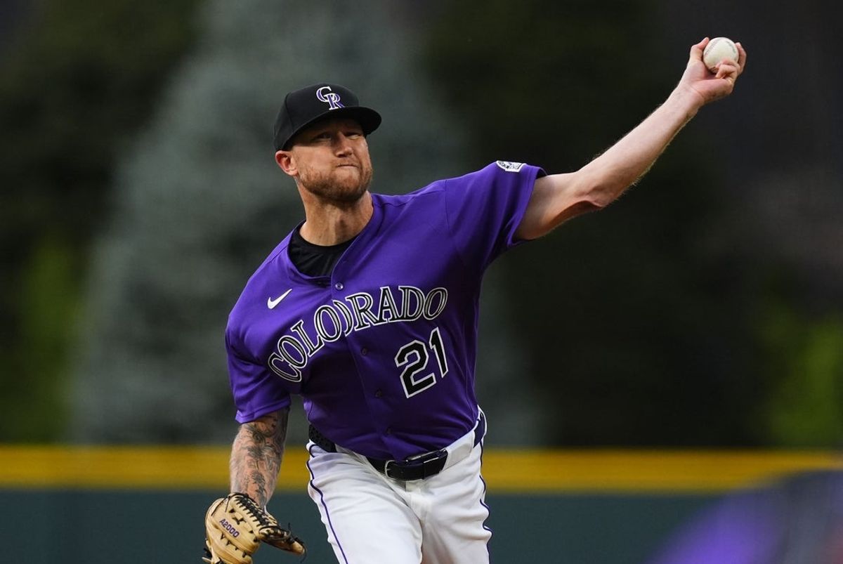 Apr 7, 2026; Denver, Colorado, USA; Colorado Rockies starting pitcher Kyle Freeland (21) delivers a pitch in the first inning against the Houston Astros at Coors Field. Mandatory Credit: Ron Chenoy-Imagn Images