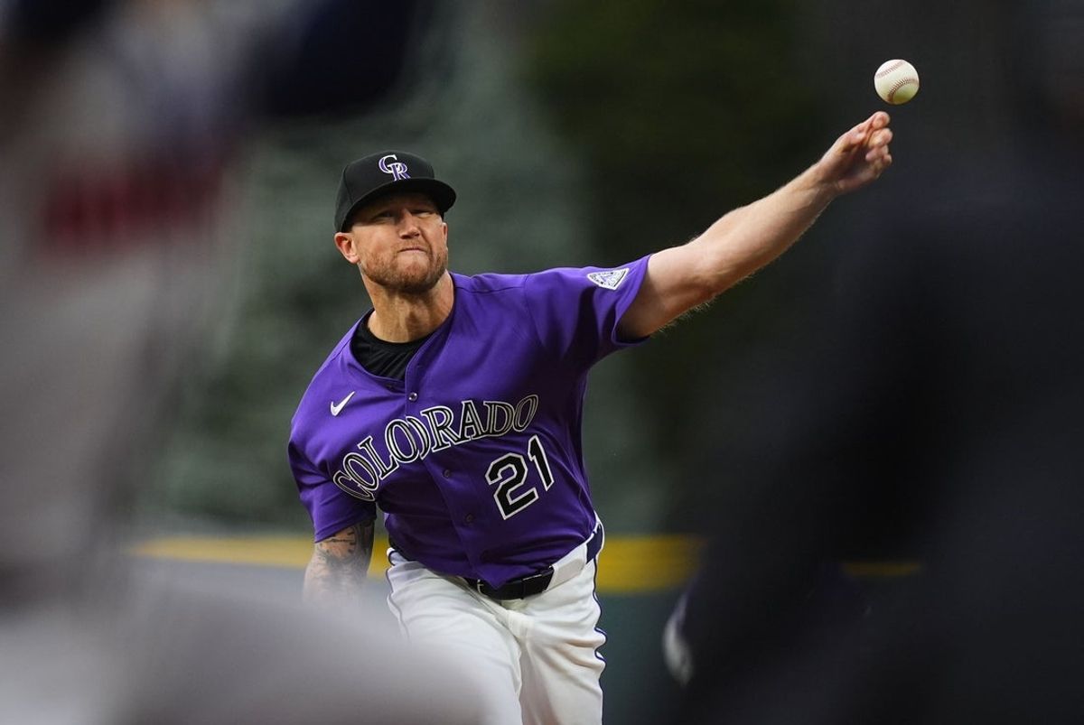 Apr 7, 2026; Denver, Colorado, USA; Colorado Rockies starting pitcher Kyle Freeland (21) delivers a pitch in the first inning against the Houston Astros at Coors Field. Mandatory Credit: Ron Chenoy-Imagn Images