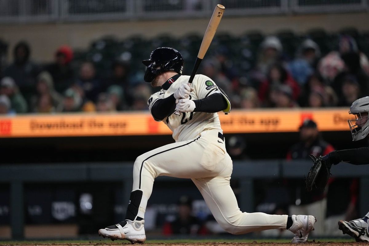 Apr 7, 2026; Minneapolis, Minnesota, USA; Minnesota Twins catcher Ryan Jeffers (27) hits a two RBI double during the fifth inning against the Detroit Tigers at Target Field. Mandatory Credit: Jordan Johnson-Imagn Images