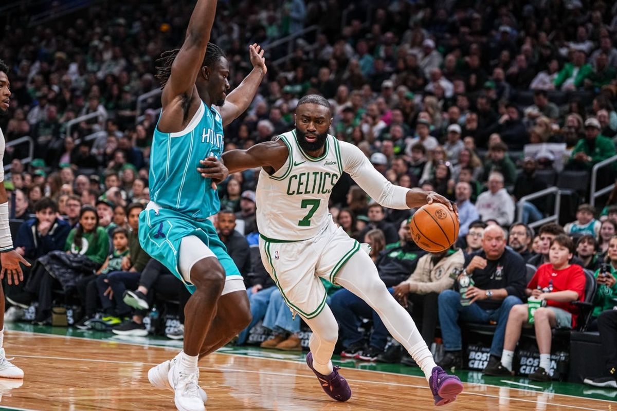 Apr 7, 2026; Boston, Massachusetts, USA; Boston Celtics guard Jaylen Brown (7) drives the ball against Charlotte Hornets guard Sion James (4) in the second quarter at TD Garden. Mandatory Credit: David Butler II-Imagn Images