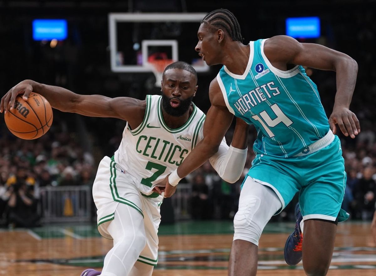 Apr 7, 2026; Boston, Massachusetts, USA; Boston Celtics guard Jaylen Brown (7) drive the ball against Charlotte Hornets forward Moussa Diabate (14) in the first quarter at TD Garden. Mandatory Credit: David Butler II-Imagn Images