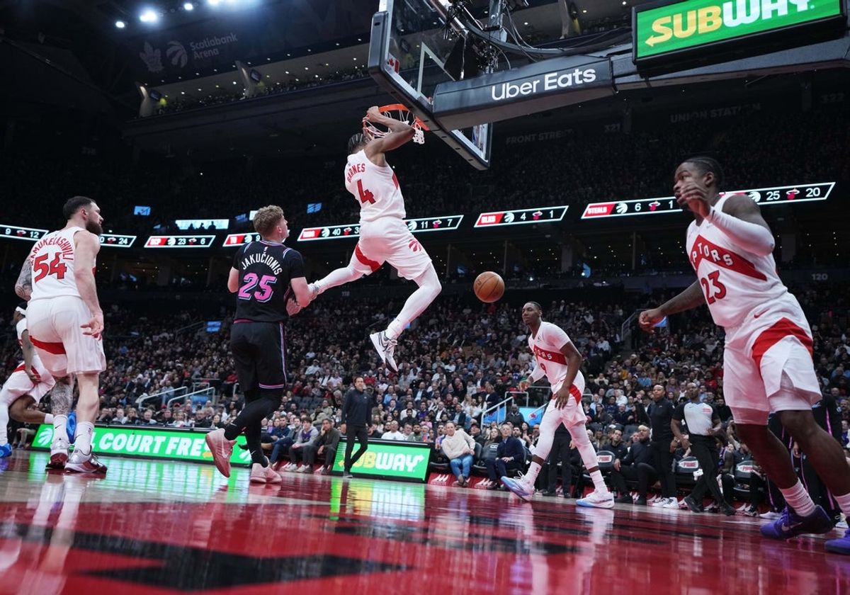 Apr 7, 2026; Toronto, Ontario, CAN; Toronto Raptors forward Scottie Barnes (4) scores a basket over Miami Heat guard Kasparas Jakucionis (25) during the third quarter at Scotiabank Arena. Mandatory Credit: Nick Turchiaro-Imagn Images
