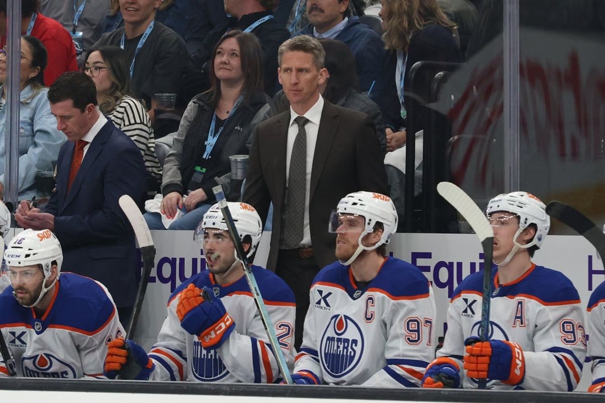 Apr 7, 2026; Salt Lake City, Utah, USA; Edmonton Oilers head coach Kris knoblauch watches play against the Utah Mammoth during the first period at Delta Center. Mandatory Credit: Rob Gray-Imagn Images