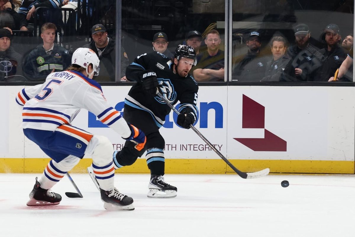 Apr 7, 2026; Salt Lake City, Utah, USA; Utah Mammoth left wing Michael Carcone (53) shoots the puck against Edmonton Oilers defenseman Connor Murphy (5) during the first period at Delta Center. Mandatory Credit: Rob Gray-Imagn Images