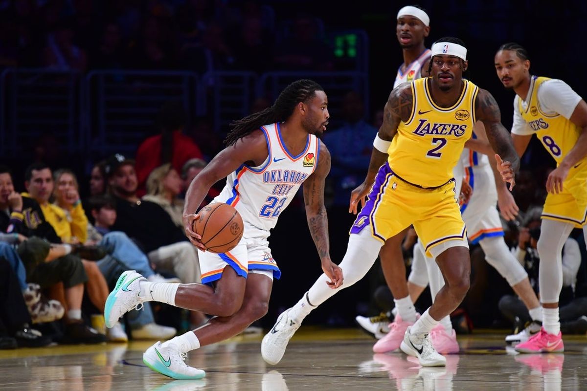 April 7, 2026; Los Angeles, California, USA; Oklahoma City Thunder guard Cason Wallace (22) moves the ball against Los Angeles Lakers forward Jarred Vanderbilt (2) during the first half at Crypto.com Arena. Mandatory Credit: Gary A. Vasquez-Imagn Images