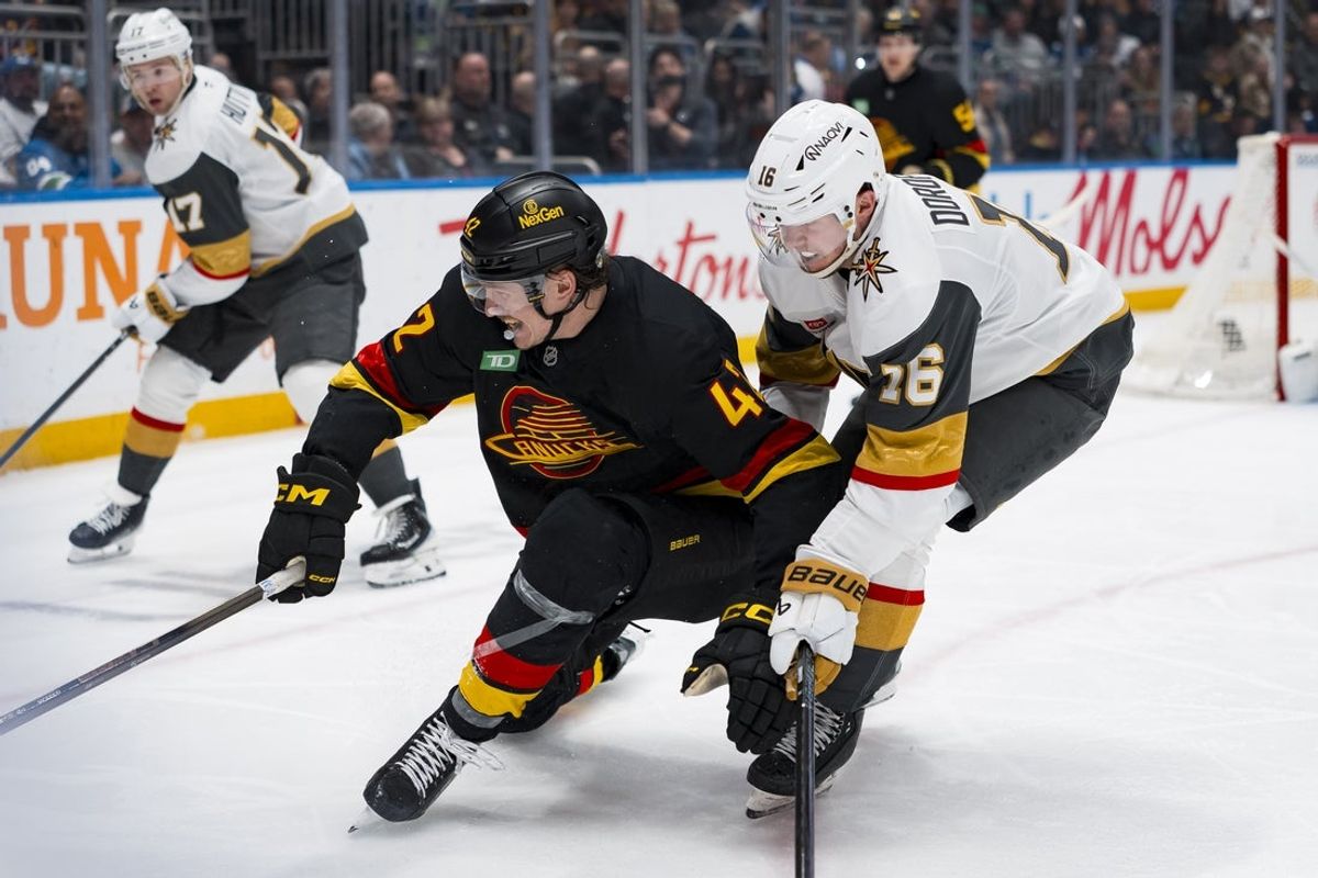 Apr 7, 2026; Vancouver, British Columbia, CAN; Vegas Golden Knights forward Pavel Dorofeyev (16) checks Vancouver Canucks forward Curtis Douglas (42) in the second period at Rogers Arena. Mandatory Credit: Bob Frid-Imagn Images