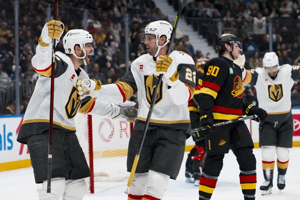 Apr 7, 2026; Vancouver, British Columbia, CAN; Vegas Golden Knights forward Nic Dowd (26) and forward Cole Smith (22) celebrate Smith’s goal against the Vancouver Canucks in the third period at Rogers Arena. Mandatory Credit: Bob Frid-Imagn Images