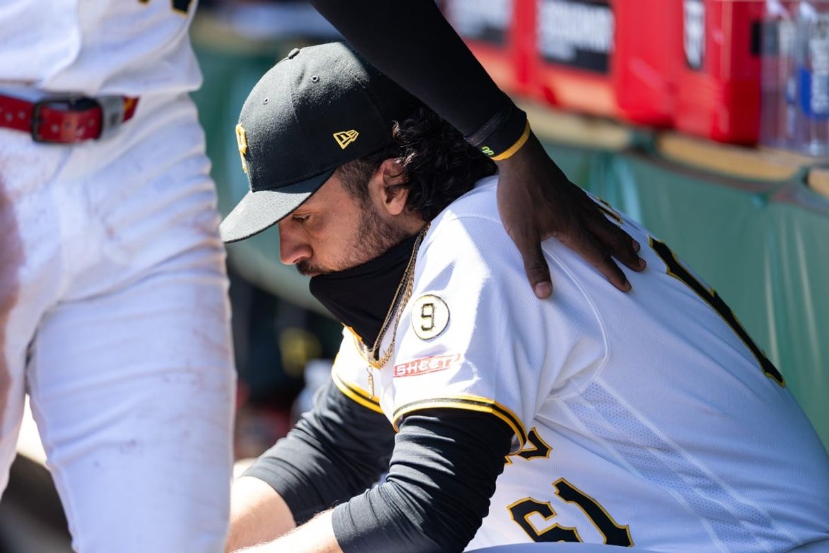 Apr 8, 2026; Pittsburgh, Pennsylvania, USA;  Pittsburgh Pirates pitcher Justin Lawrence (61) is patted on the shoulder in the dugout after giving up four runs during the seventh inning against the San Diego Padres at PNC Park. Mandatory Credit: Scott Galvin-Imagn Images