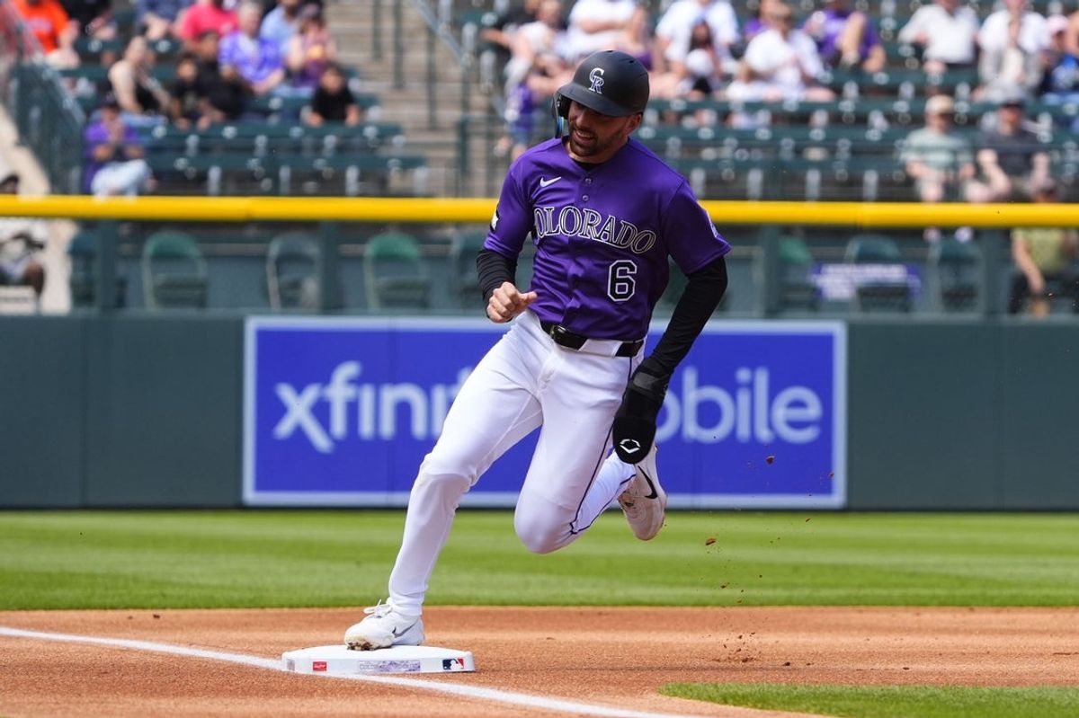 Apr 8, 2026; Denver, Colorado, USA; Colorado Rockies second baseman Edouard Julien (6) heads home to score a run in the first inning against the Houston Astros  at Coors Field. Mandatory Credit: Ron Chenoy-Imagn Images