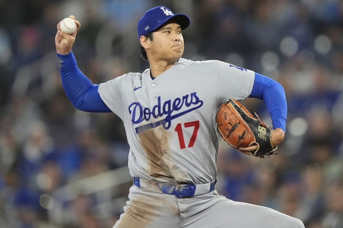 Apr 8, 2026; Toronto, Ontario, CAN; Los Angeles Dodgers starting pitcher Shohei Ohtani (17) pitches to the Toronto Blue Jays during the first inning at Rogers Centre. Mandatory Credit: John E. Sokolowski-Imagn Images