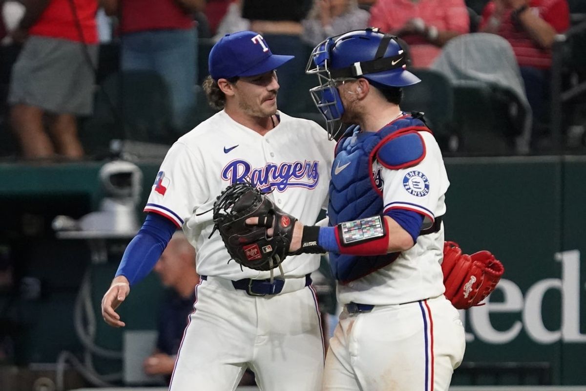 Apr 8, 2026; Arlington, Texas, USA;  Texas Rangers pitcher Cole Winn (60) and catcher Danny Jansen (9) react after defeating the Seattle Mariners at Globe Life Field. Mandatory Credit: Raymond Carlin III-Imagn Images